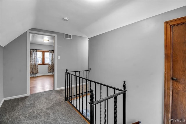 25 Cresthaven Dr, Cheektowaga, NY 14225 - hallway with an upstairs landing, carpet flooring, and vaulted ceiling