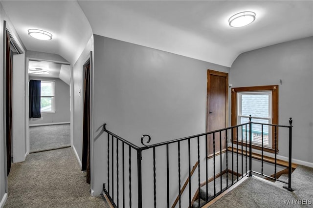 25 Cresthaven Dr, Cheektowaga, NY 14225 - hallway with an upstairs landing, lofted ceiling, and carpet