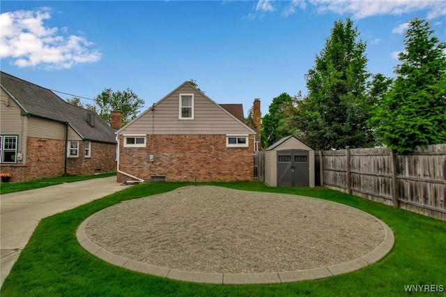 25 Cresthaven Dr, Cheektowaga, NY 14225 - back of house featuring a shed, brick siding, and a chimney