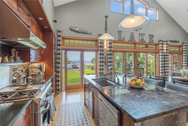 32 Coblesub Rd, West Monroe, NY 13036 - kitchen featuring high vaulted ceiling, appliances with stainless steel finishes, under cabinet range hood, a kitchen island with sink, and hanging light fixtures