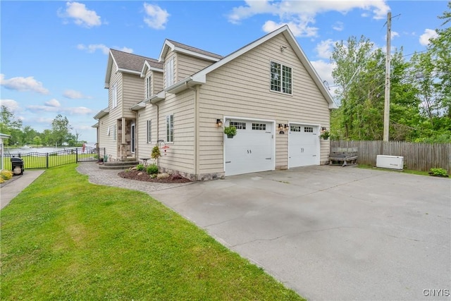 32 Coblesub Rd, West Monroe, NY 13036 - view of home's exterior featuring a garage and concrete driveway