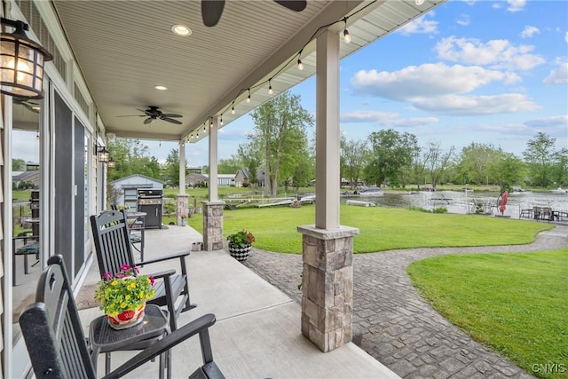 32 Coblesub Rd, West Monroe, NY 13036 - view of patio / terrace with ceiling fan and a water view