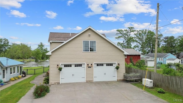 32 Coblesub Rd, West Monroe, NY 13036 - view of side of property with concrete driveway and a water view