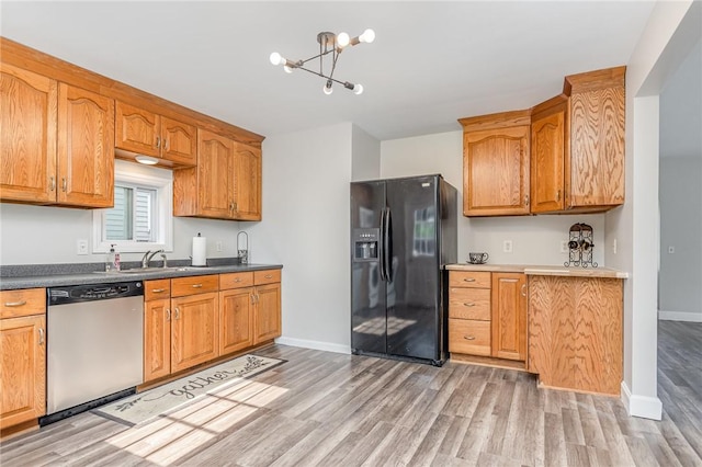 2761 Mount Read Blvd, Greece, NY 14616 - kitchen featuring stainless steel dishwasher, black fridge with ice dispenser, light wood finished floors, a chandelier, and brown cabinets