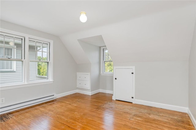 2761 Mount Read Blvd, Greece, NY 14616 - additional living space featuring a baseboard radiator, light wood-style flooring, and vaulted ceiling
