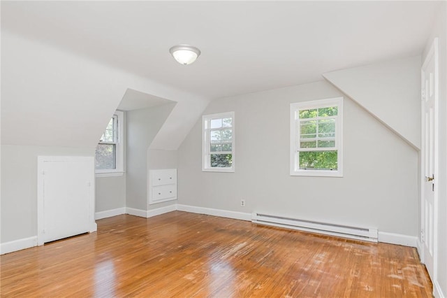 2761 Mount Read Blvd, Greece, NY 14616 - additional living space featuring baseboard heating, light wood-style floors, and vaulted ceiling