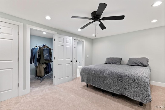 7446 Collamer Rd, Manlius, NY 13057 - bedroom with light colored carpet, a walk in closet, recessed lighting, a closet, and a ceiling fan