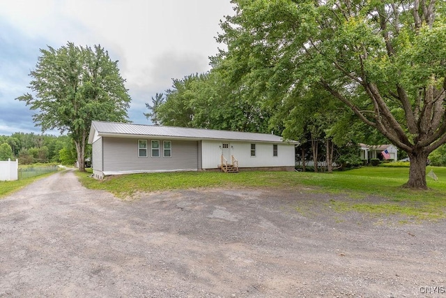 7446 Collamer Rd, Manlius, NY 13057 - single story home with a metal roof, a front yard, and driveway