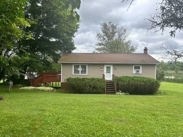 2226 Deiter Rd, Wayland, NY 14572 - view of front of property with a front lawn, a chimney, and a wooden deck