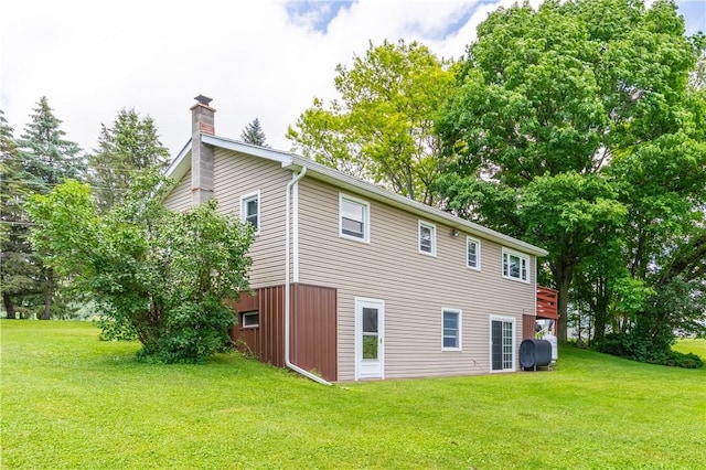 2226 Deiter Rd, Wayland, NY 14572 - back of house with a chimney, a lawn, and heating fuel