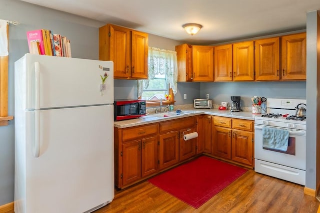 2226 Deiter Rd, Wayland, NY 14572 - kitchen featuring white appliances, light countertops, and brown cabinets