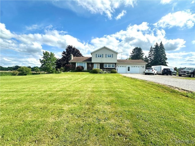 9718 Pearson Rd, Hartland, NY 14105 - view of front of home featuring driveway, an attached garage, and a front yard