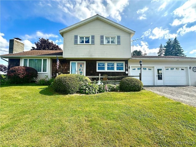 9718 Pearson Rd, Hartland, NY 14105 - split level home featuring a garage, driveway, a front lawn, and a chimney