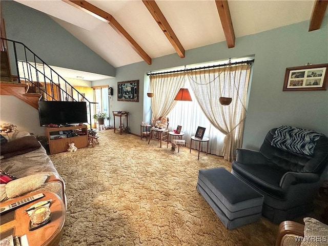 9718 Pearson Rd, Hartland, NY 14105 - carpeted living room featuring beam ceiling, stairs, and high vaulted ceiling