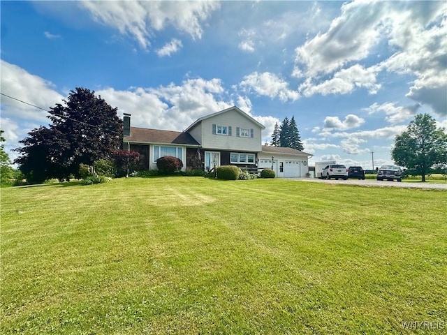 9718 Pearson Rd, Hartland, NY 14105 - view of front of home featuring a garage, a chimney, a front lawn, and driveway
