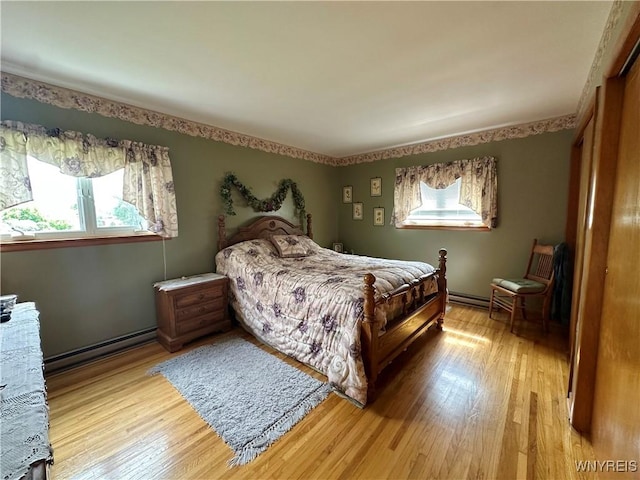 9718 Pearson Rd, Hartland, NY 14105 - bedroom featuring light wood-type flooring and a baseboard radiator