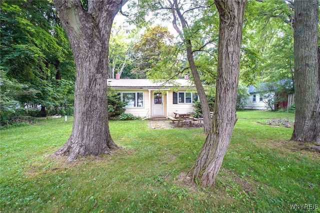 711 Sandy Ave, Evans, NY 14006 - single story home featuring a front yard and a metal roof