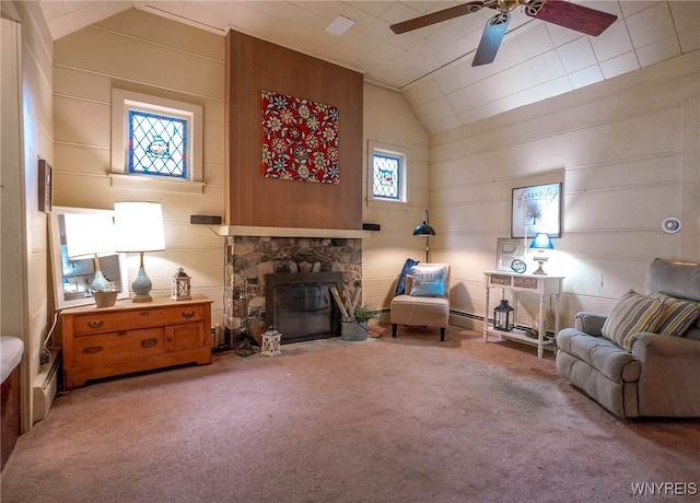 711 Sandy Ave, Evans, NY 14006 - carpeted living room with ceiling fan, vaulted ceiling, and a stone fireplace