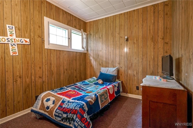 711 Sandy Ave, Evans, NY 14006 - bedroom featuring carpet, wooden walls, and crown molding