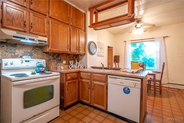 711 Sandy Ave, Evans, NY 14006 - kitchen with white appliances, exhaust hood, a peninsula, brown cabinetry, and ceiling fan