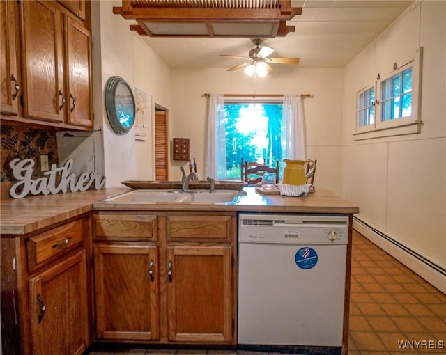 711 Sandy Ave, Evans, NY 14006 - kitchen with white dishwasher, a ceiling fan, brown cabinets, and plenty of natural light
