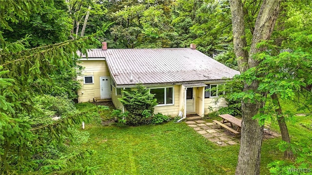 711 Sandy Ave, Evans, NY 14006 - view of front of house featuring a front yard and a metal roof
