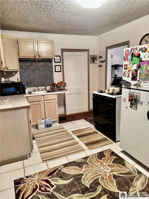 417 4th Ave, Olean-City, NY 14760 - kitchen with white appliances, a textured ceiling, light tile patterned flooring, light countertops, and light brown cabinets