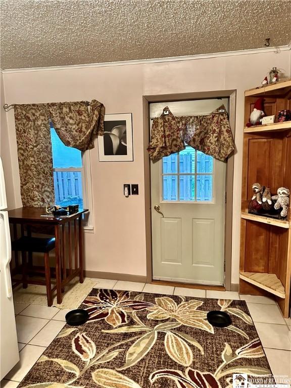 417 4th Ave, Olean-City, NY 14760 - entrance foyer with light tile patterned floors, a textured ceiling, and plenty of natural light