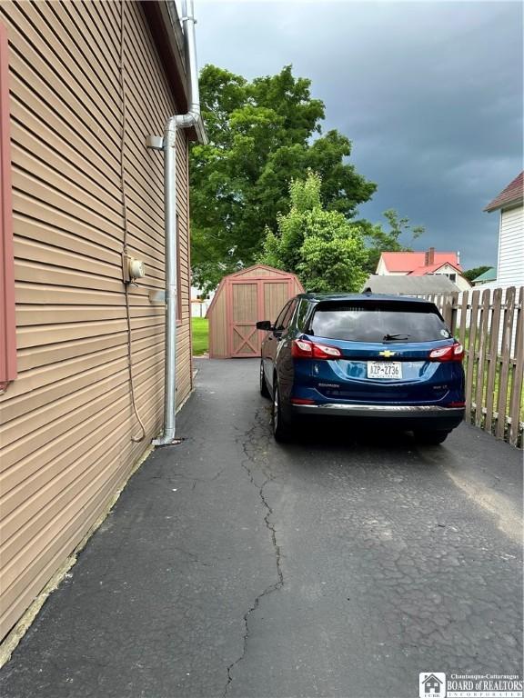 417 4th Ave, Olean-City, NY 14760 - view of vehicle parking with a shed