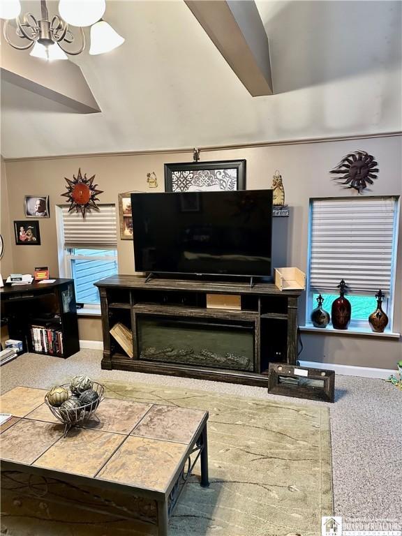 417 4th Ave, Olean-City, NY 14760 - carpeted living room featuring a chandelier and vaulted ceiling