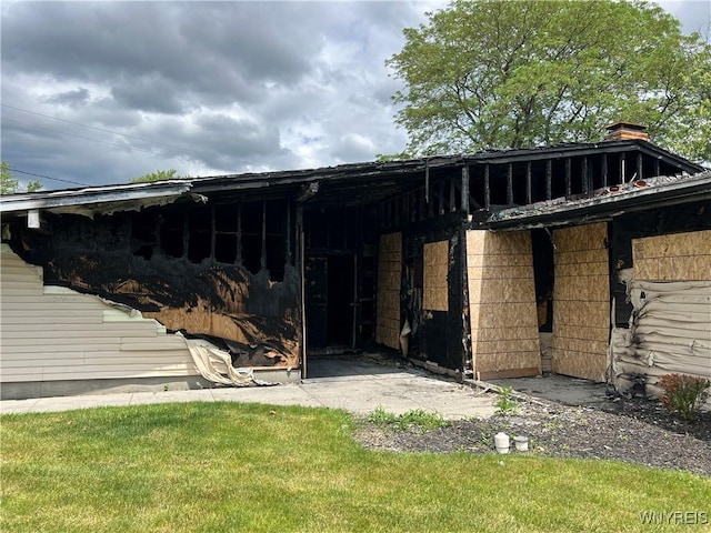 69 Steele Cir, Niagara, NY 14304 - back of property with a chimney and a lawn