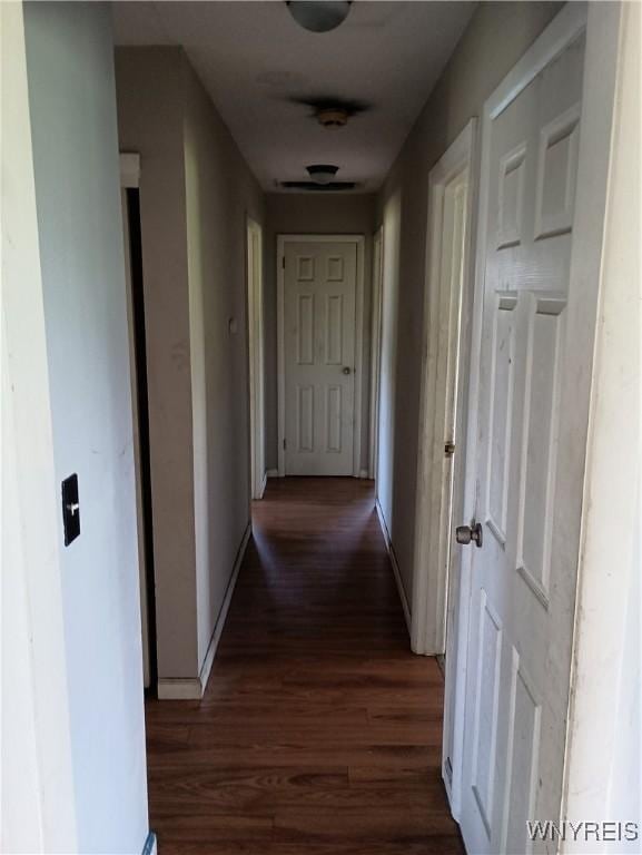 69 Steele Cir, Niagara, NY 14304 - hallway featuring dark wood-type flooring and baseboards