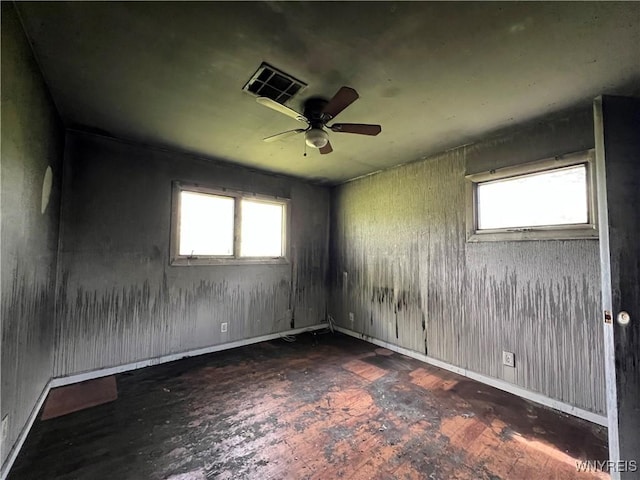 69 Steele Cir, Niagara, NY 14304 - empty room featuring wood-type flooring, plenty of natural light, and a ceiling fan