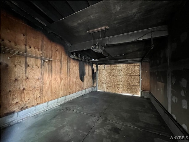 69 Steele Cir, Niagara, NY 14304 - below grade area featuring a garage and wood walls