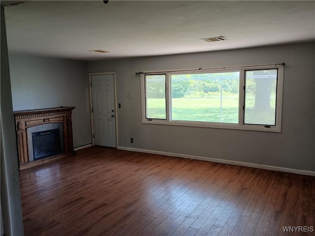 71 Steele Cir, Niagara, NY 14304 - unfurnished living room featuring wood finished floors and a fireplace