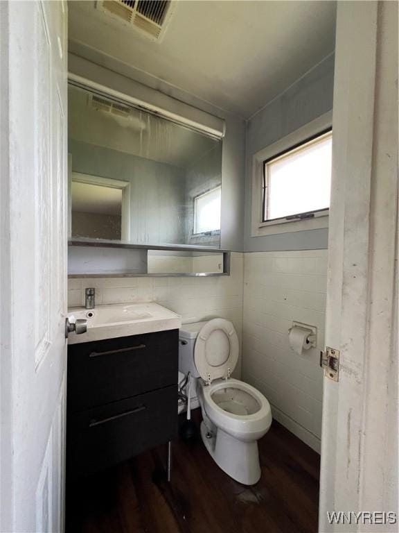 71 Steele Cir, Niagara, NY 14304 - half bathroom featuring wood finished floors and vanity