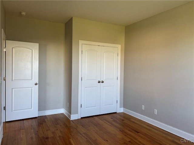 165 Shaker Hts, Camillus, NY 13031 - unfurnished bedroom featuring a closet and wood finished floors