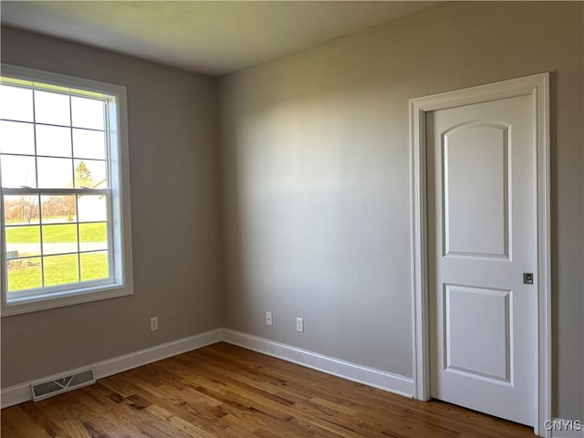165 Shaker Hts, Camillus, NY 13031 - spare room featuring wood finished floors and baseboards