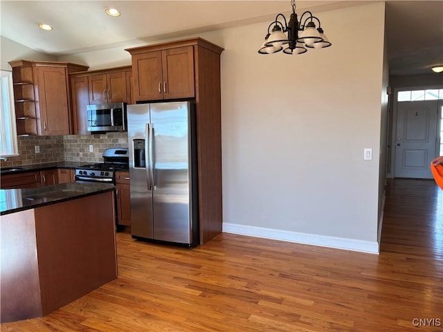 165 Shaker Hts, Camillus, NY 13031 - kitchen featuring stainless steel appliances, light wood-style flooring, a chandelier, and recessed lighting
