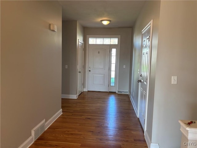 165 Shaker Hts, Camillus, NY 13031 - foyer featuring dark wood finished floors and baseboards