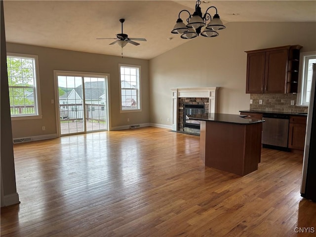 165 Shaker Hts, Camillus, NY 13031 - kitchen featuring stainless steel dishwasher, open floor plan, dark countertops, ceiling fan, and a kitchen island