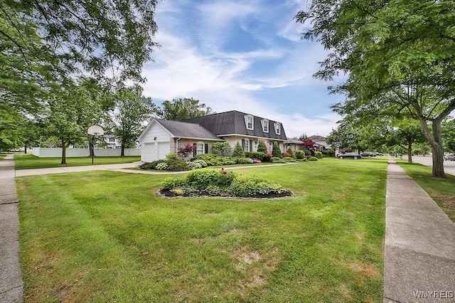 177 Foxpoint W, Amherst, NY 14221 - view of front of home with a front yard, an attached garage, concrete driveway, and a shingled roof