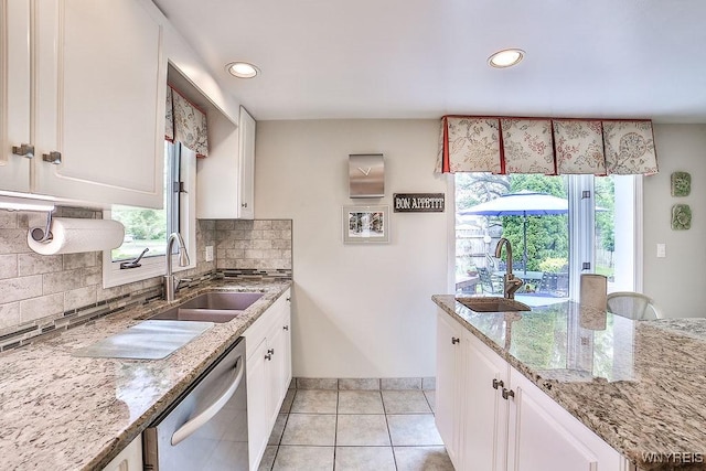 177 Foxpoint W, Amherst, NY 14221 - kitchen with dishwasher, recessed lighting, white cabinetry, backsplash, and light tile patterned floors