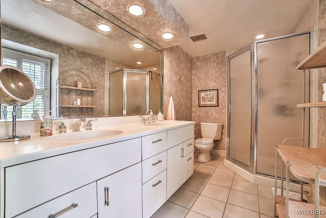 177 Foxpoint W, Amherst, NY 14221 - bathroom featuring double vanity, a shower stall, tile patterned floors, and recessed lighting