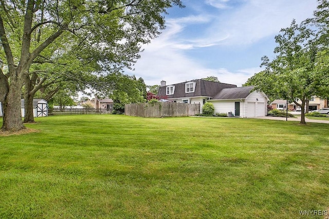 177 Foxpoint W, Amherst, NY 14221 - view of yard featuring a storage unit, driveway, and a garage