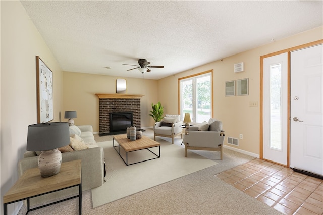 72 Juliane Dr, Gates, NY 14624 - carpeted living room with ceiling fan, a fireplace, and a textured ceiling