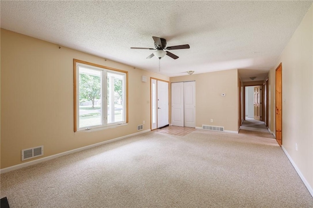 72 Juliane Dr, Gates, NY 14624 - empty room with light carpet, a ceiling fan, and a textured ceiling
