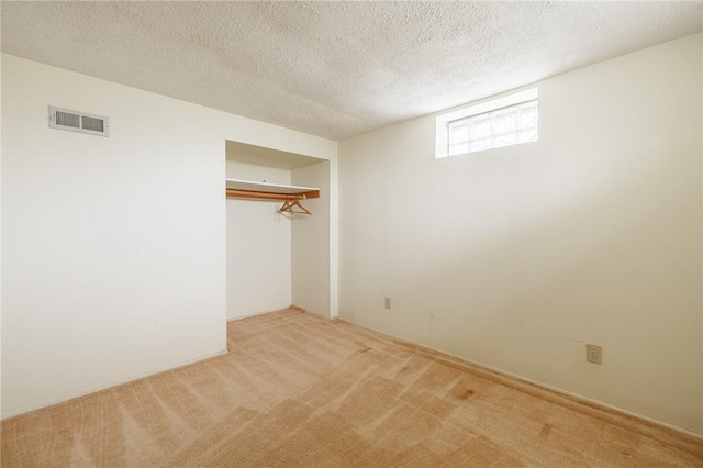 72 Juliane Dr, Gates, NY 14624 - unfurnished bedroom with carpet flooring, a closet, and a textured ceiling