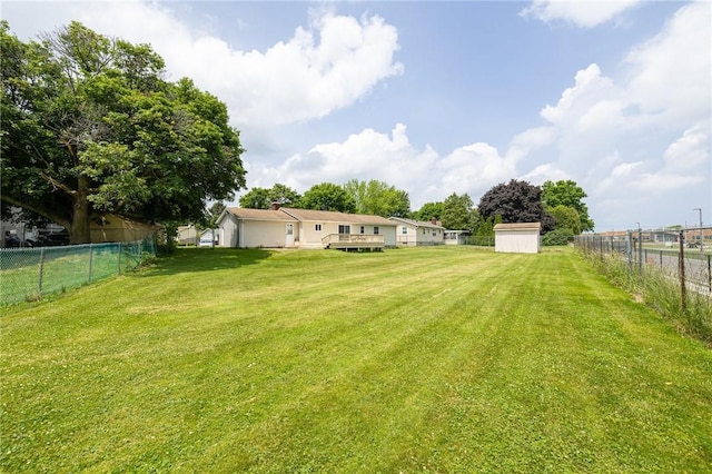 72 Juliane Dr, Gates, NY 14624 - fenced backyard featuring a wooden deck and a shed