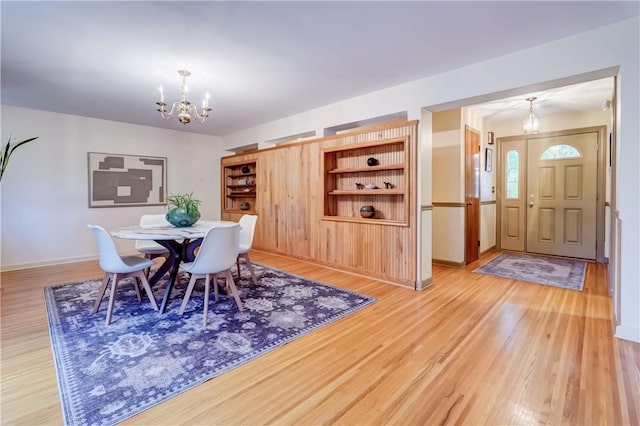 107 Fieldston Ter, Brighton, NY 14610 - dining space featuring a chandelier and light wood-type flooring